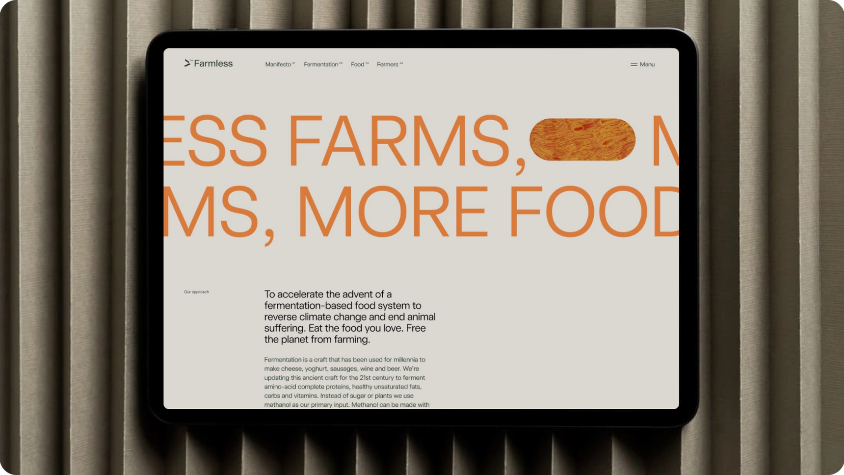 A tablet displaying a Farmless landing page.
