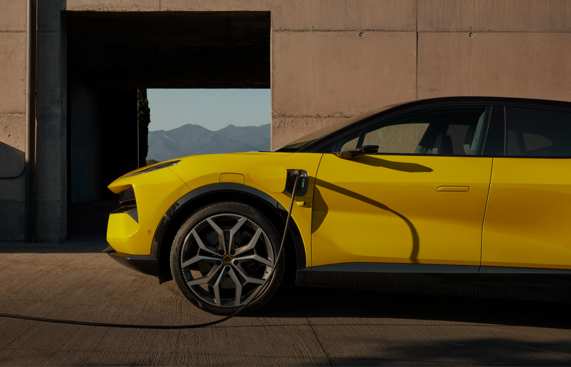 Side view of the Lotus Eletre being charged.