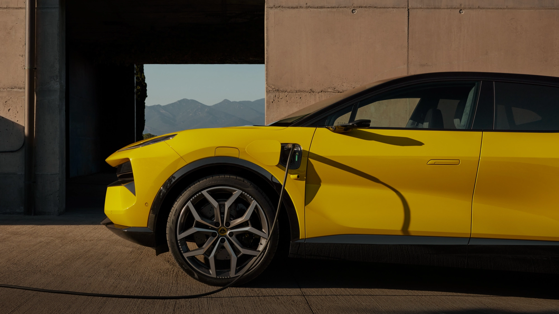 Side view of the Lotus Eletre being charged.
