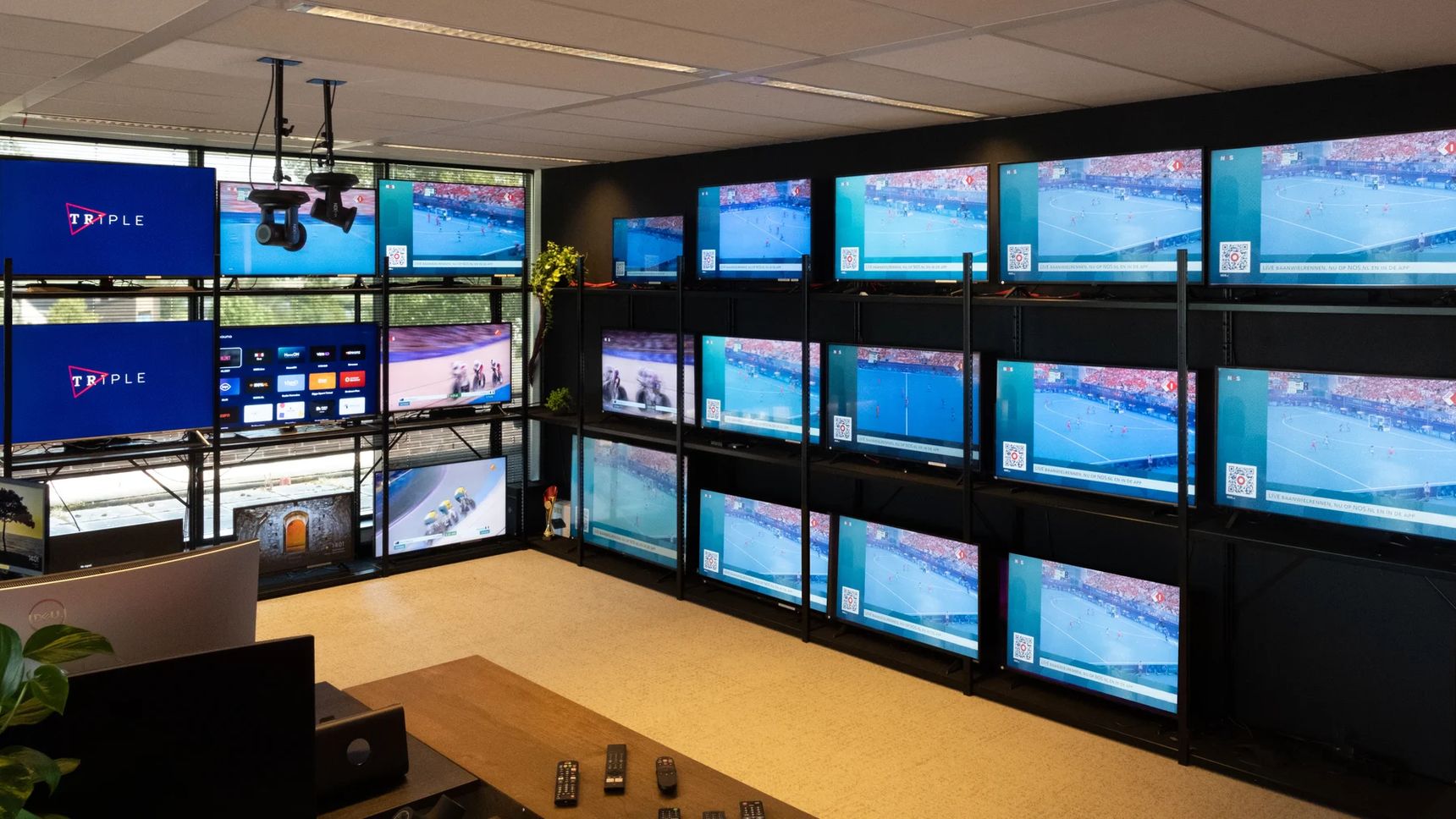 The OTT testlab in Hypersolid's Alkmaar office. About twenty smart TVs of different brands and sizes in operation.
