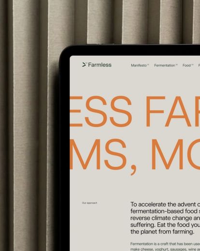 A tablet close up displaying a Farmless landing page.
