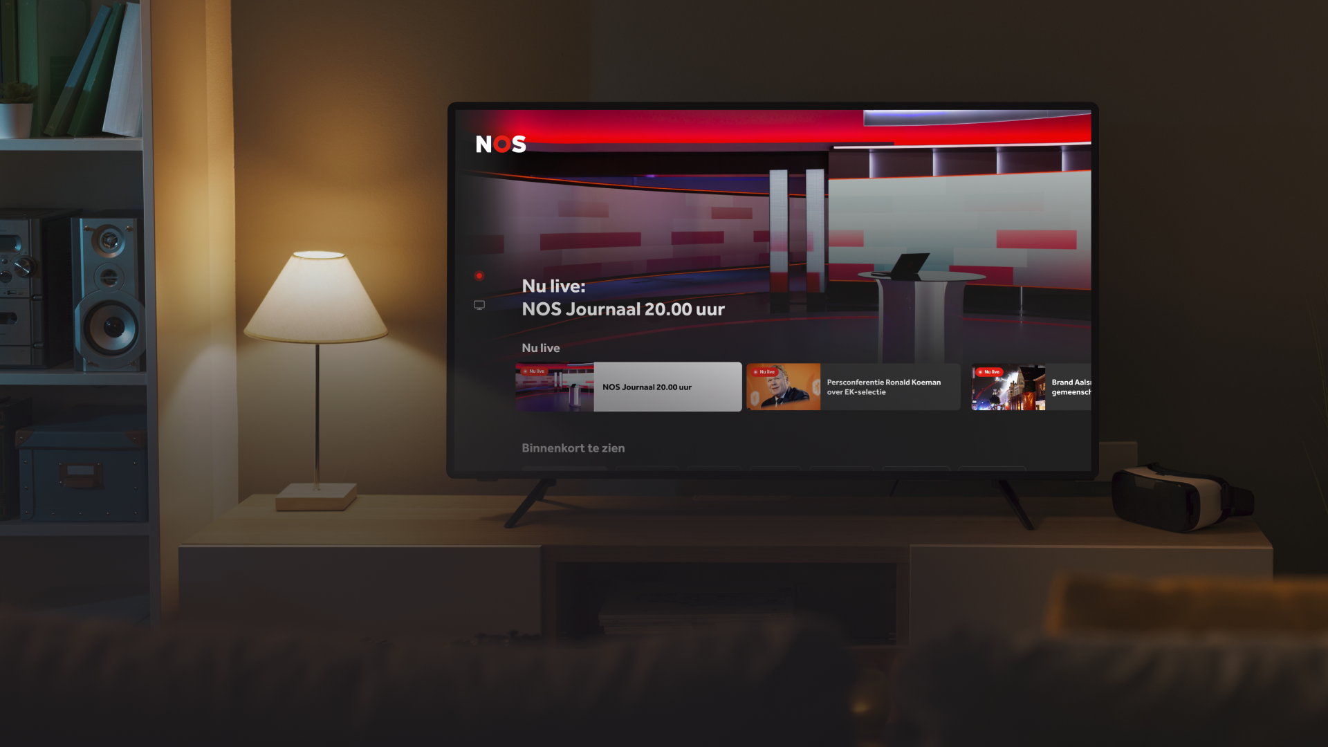 Living room setting with a smart TV displaying the NOS Live connected TV app.