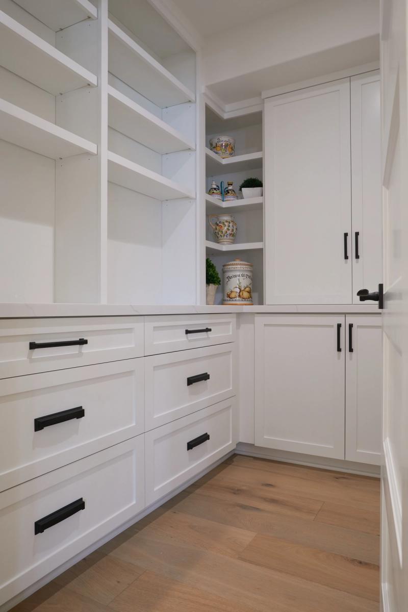 Walk-in pantry with corner shelves
