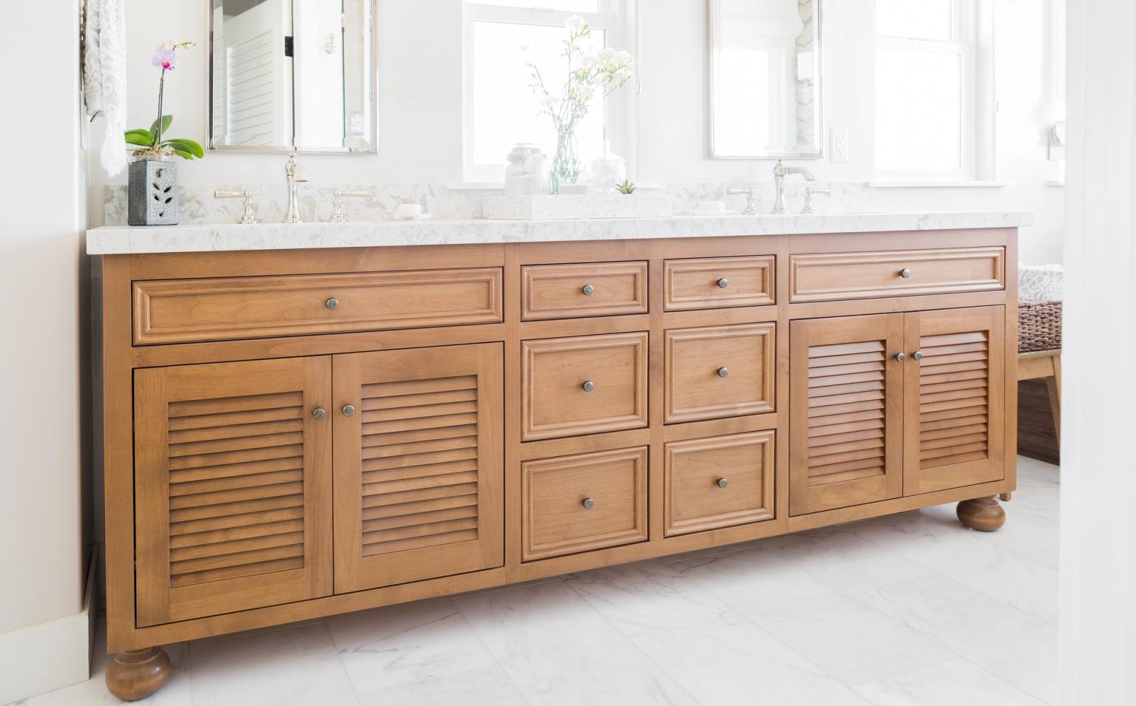 Cherry vanity cabinet with inset face frame and louvered doors