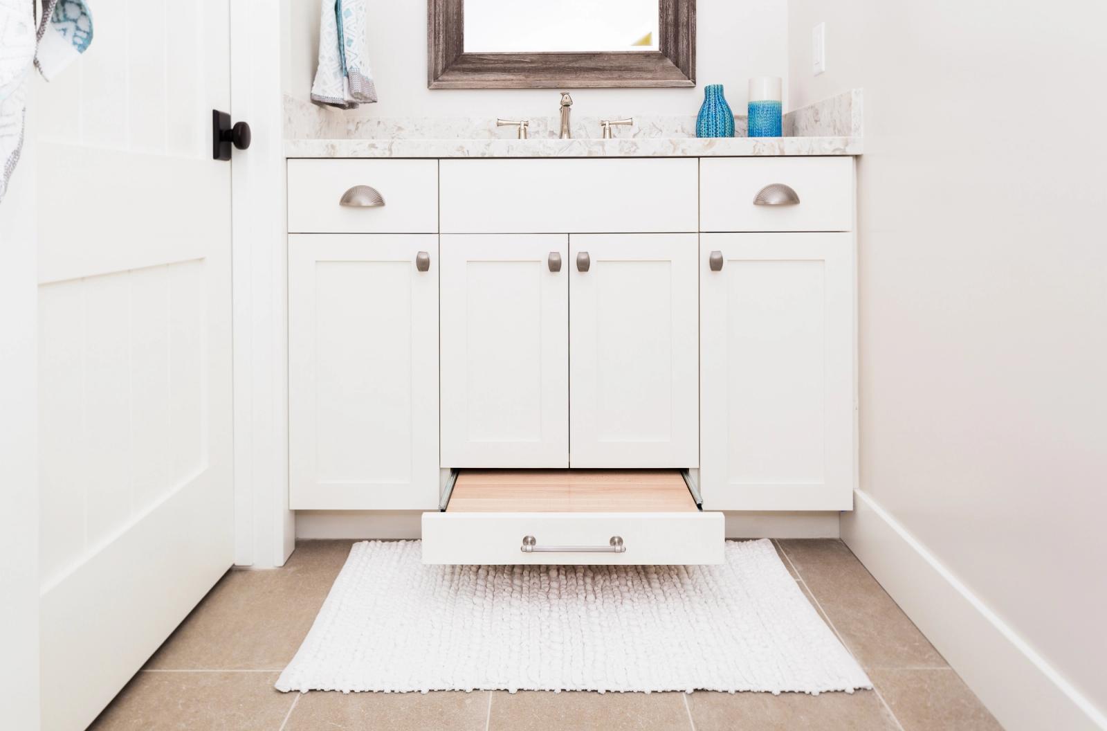 White shaker vanity with built-in step stool