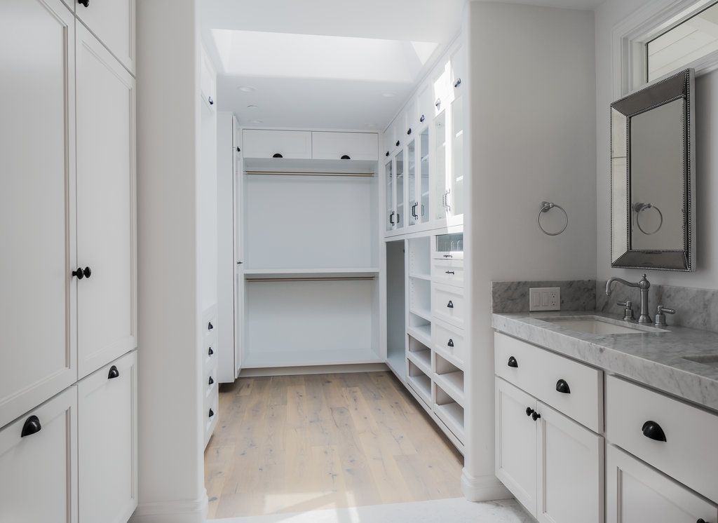 A beautiful custom closet with every amenity. Shoe pull-out, pants storage, etc.