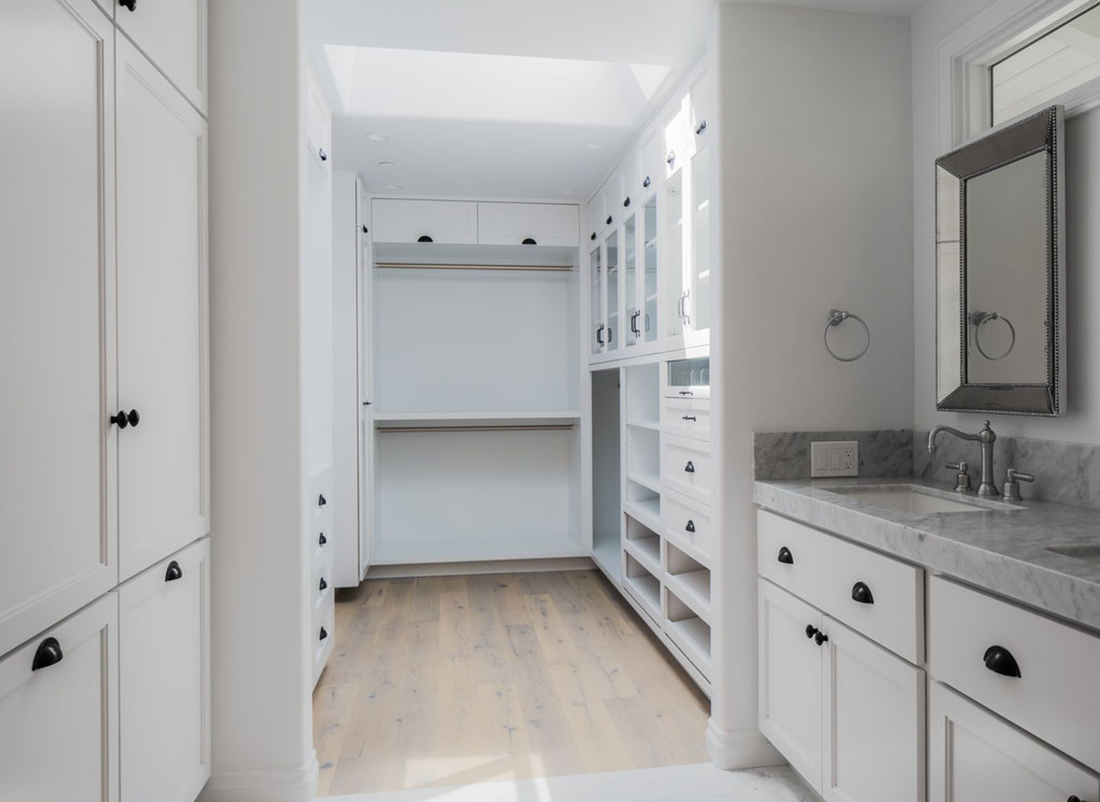 A beautiful custom closet with every amenity. Shoe pull-out, pants storage, etc.