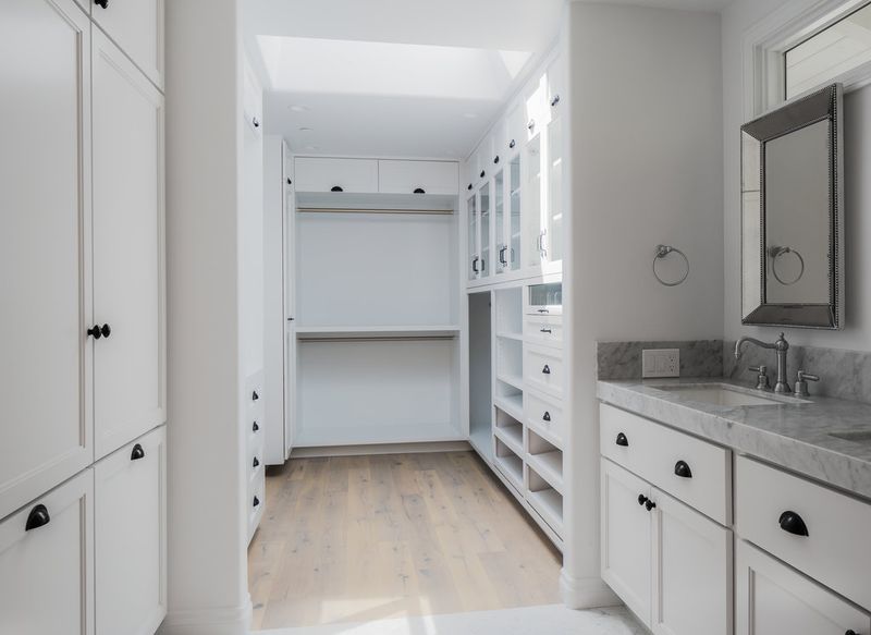 A beautiful custom closet with every amenity. Shoe pull-out, pants storage, etc.