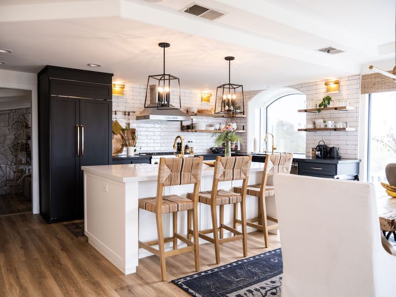Black matte cabinets and white farmhouse sink island