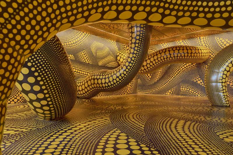 Yayoi Kusama installation view at Fondation Beyeler with mirrored pumpkin sculpture.