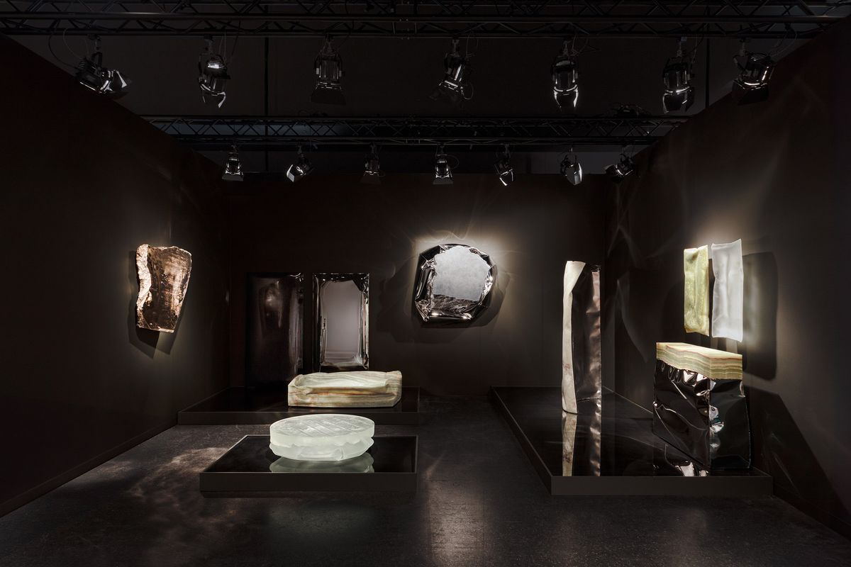 Ben Storms' Crushed series metal works floating above the water-floor of the Objects with Narratives booth.