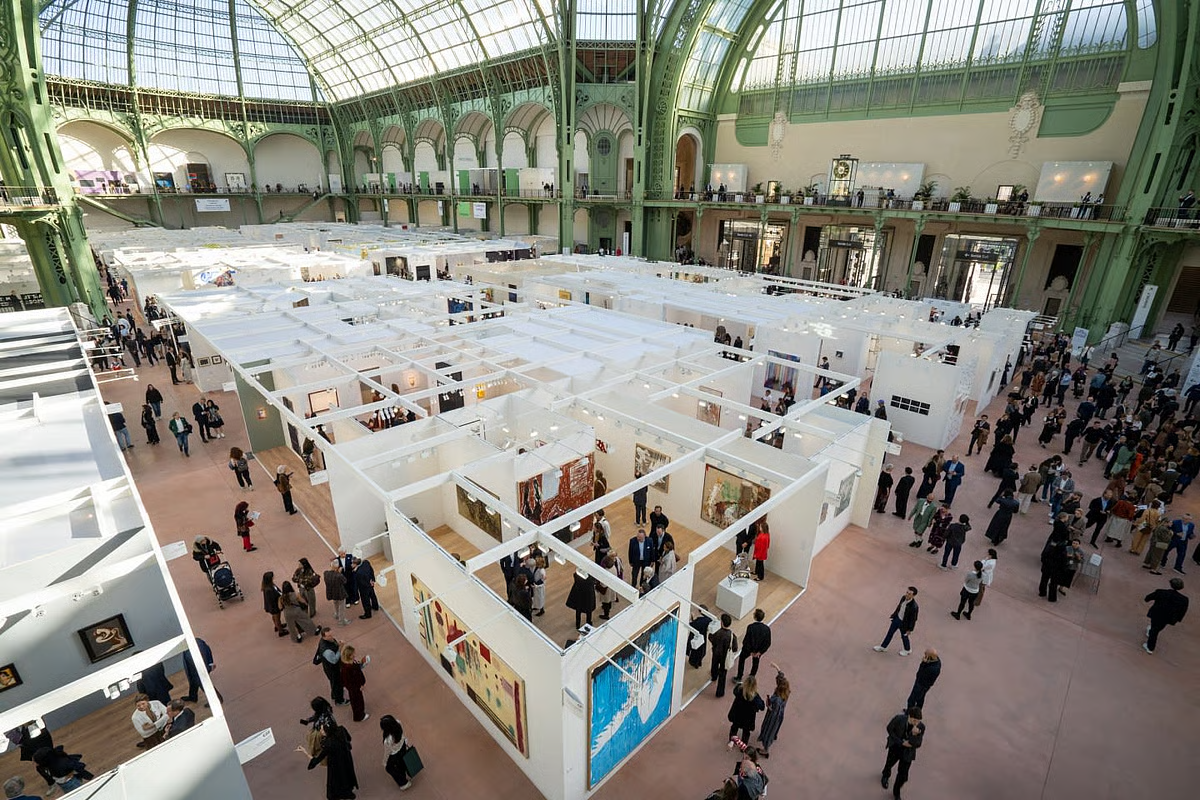 Aerial view of Art Basel Paris 2024 under the glass roof of the Grand Palais.