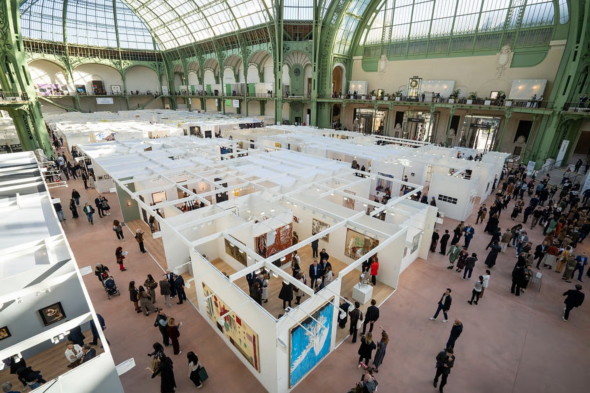Aerial view of Art Basel Paris 2024 under the glass roof of the Grand Palais.