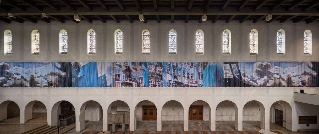 A 36-metre printed curtain hangs across the nave of the Christ-Koenig church in Bochum.
