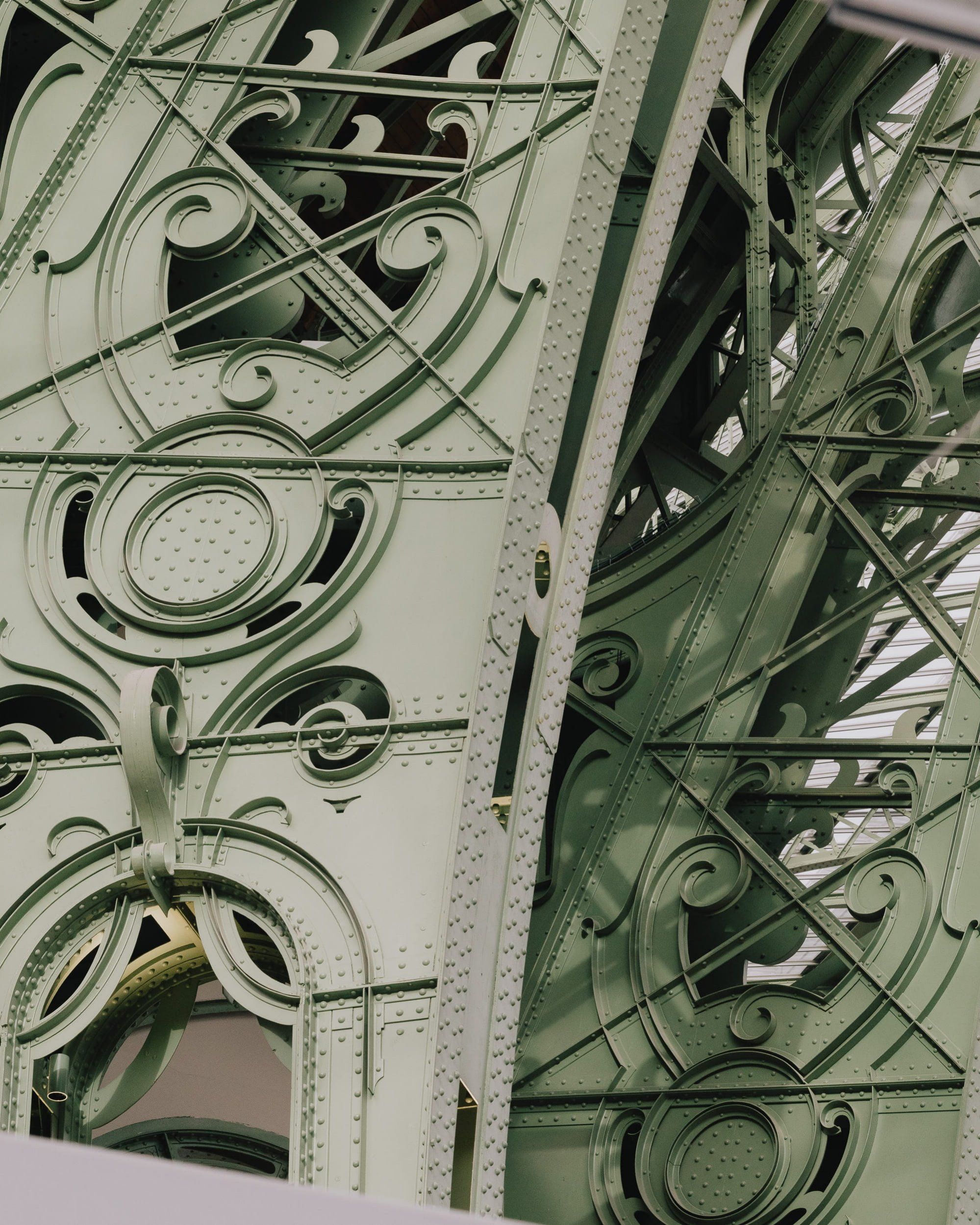Close view of the green Art Nouveau ironwork of the Grand Palais in Paris.