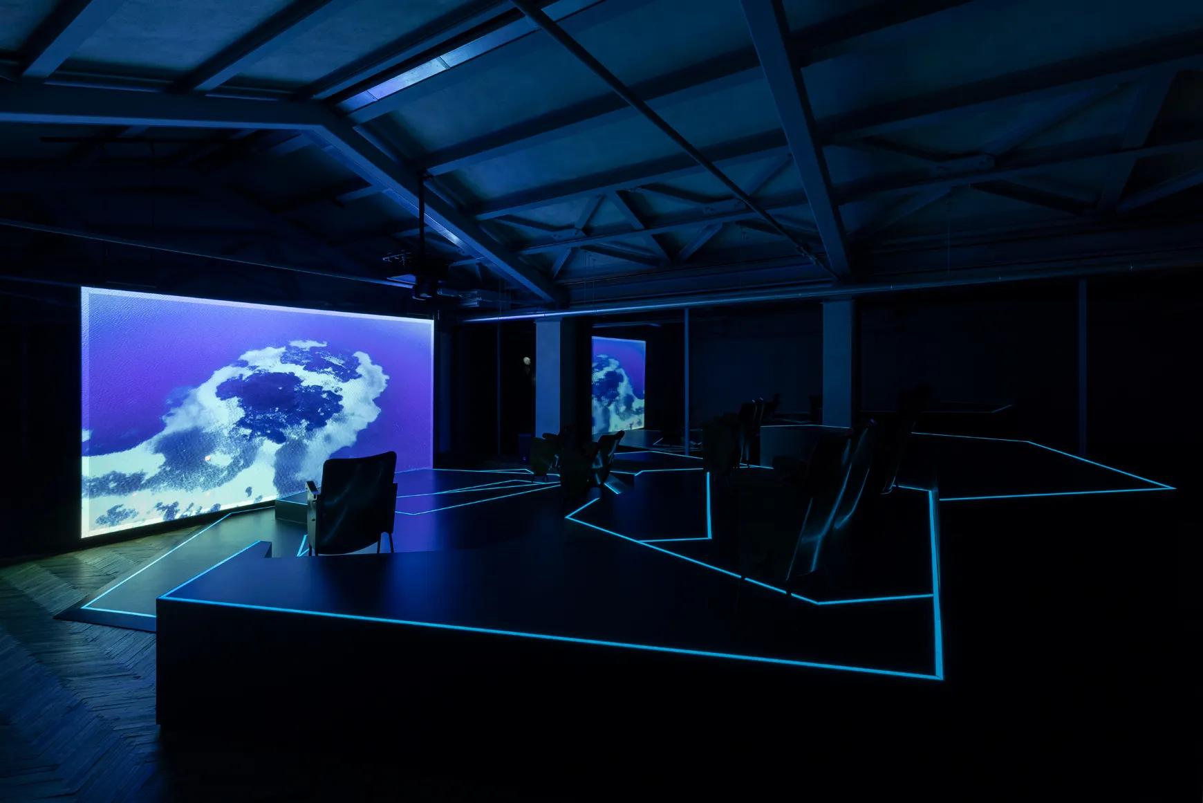 Video projection and mixed-media installation view of Hito Steyerl's The Island at Osservatorio, Milan.