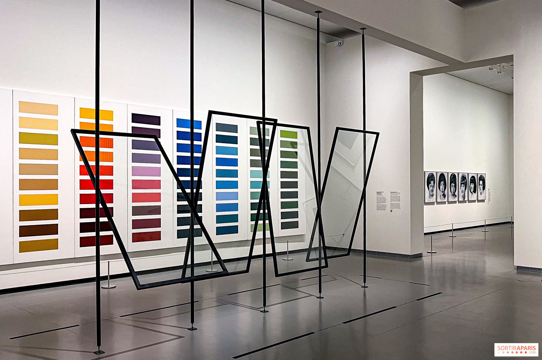 Installation view of Gerhard Richter retrospective at Fondation Louis Vuitton, Paris, 2025, with large abstract paintings on white walls.