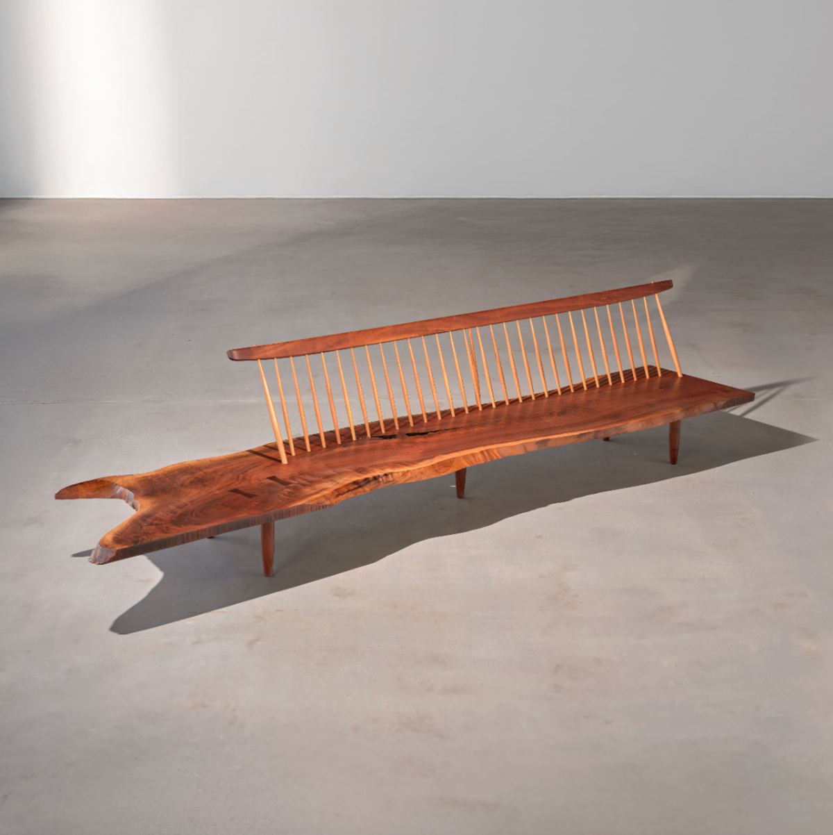 Pair of bookmatched Conoid Benches, 1972, by George Nakashima, presented by Moderne Gallery at Design Miami 2025.