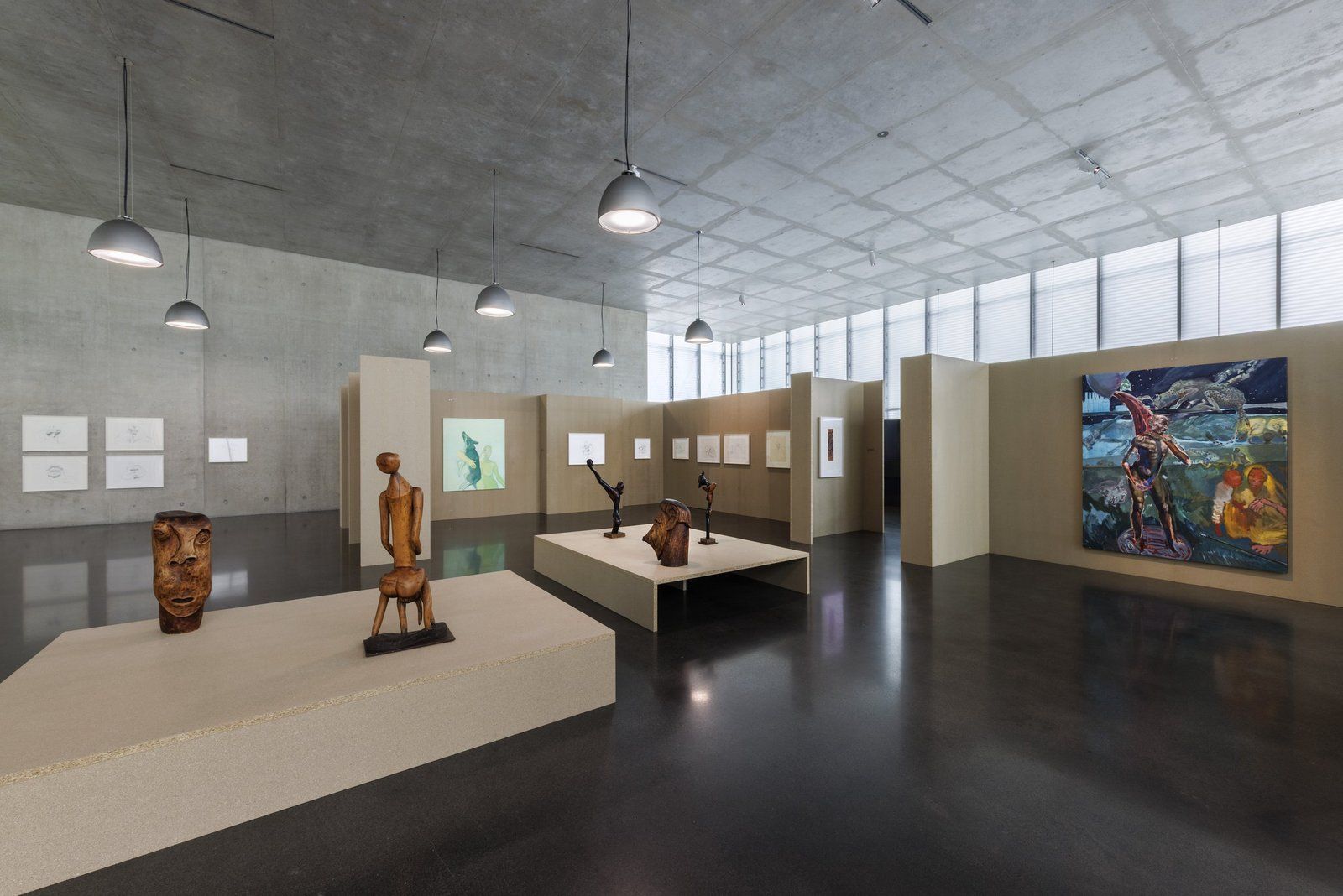 Installation view on the ground floor of Kunsthaus Bregenz, July 2025, with paintings and sculpture by Michael Armitage, Maria Lassnig and Chelenge Van Rampelberg.