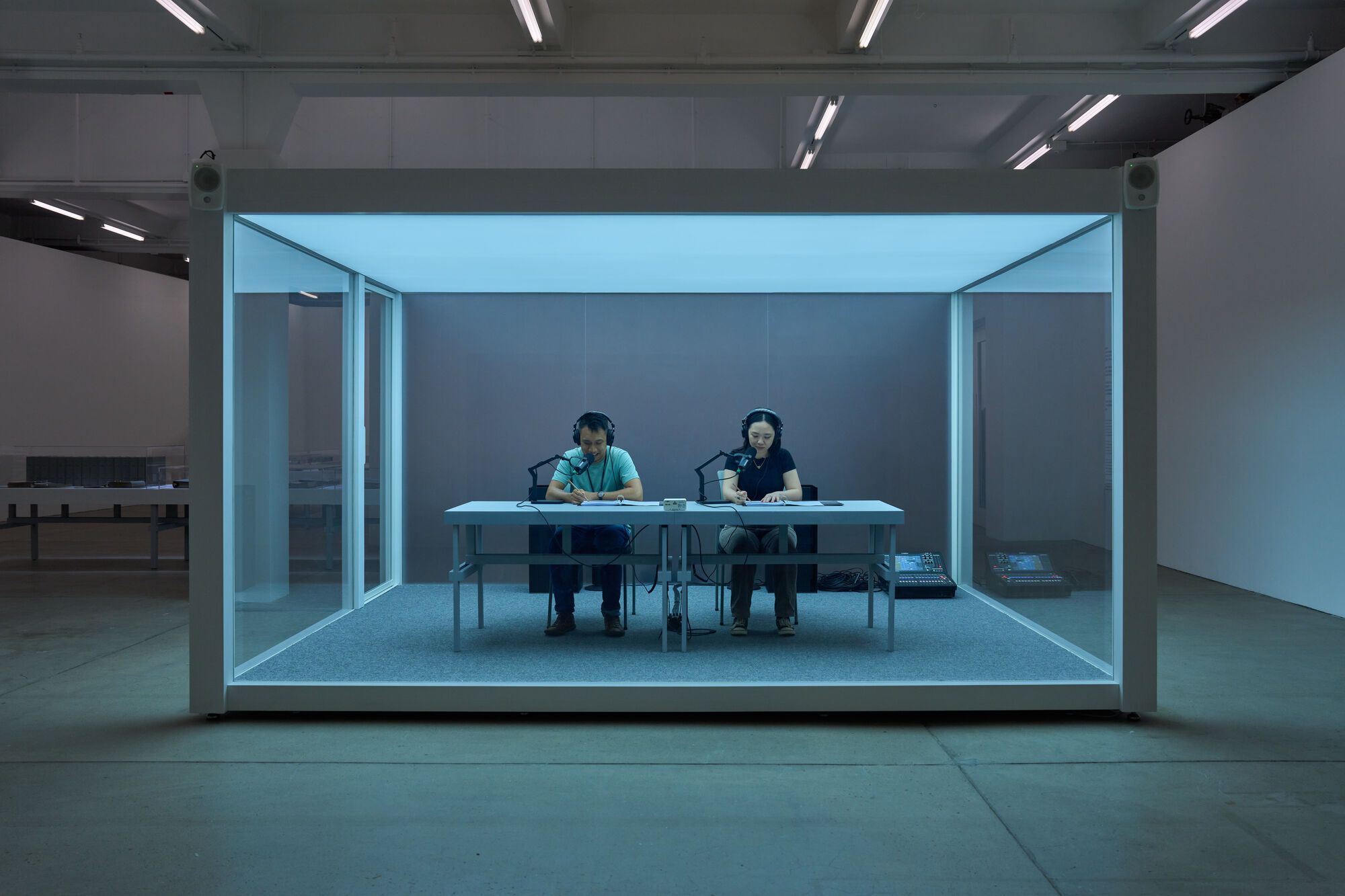 Installation view of On Kawara's One Million Years performance with seated readers.