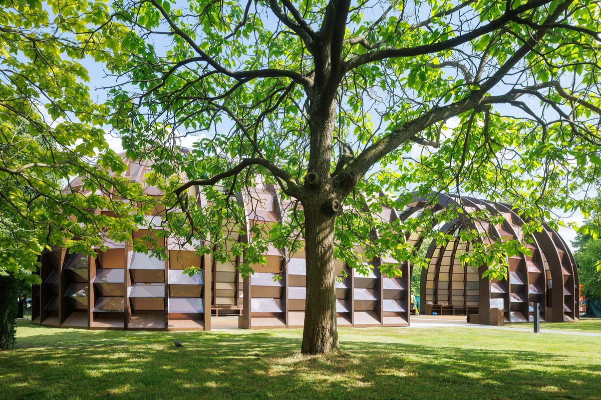 Interior view of Marina Tabassum's 2025 Serpentine Pavilion showing the timber capsule volumes and central courtyard.