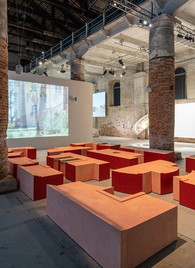 Terracotta-hued deconstructed façade modules of Borgo Rizza installed at the Corderie, Venice Arsenale, 2023.