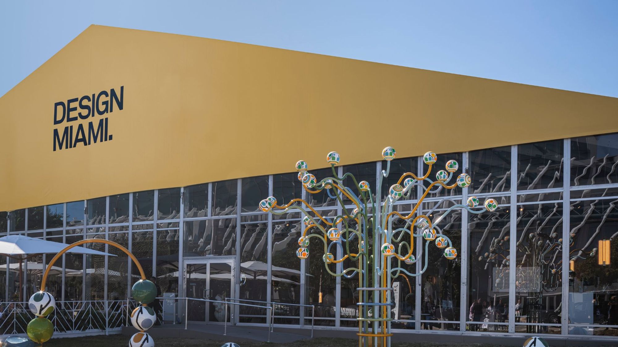 Wide view of Design Miami 2025 at the Miami Beach tent, curated by Glenn Adamson under the theme Make. Believe.