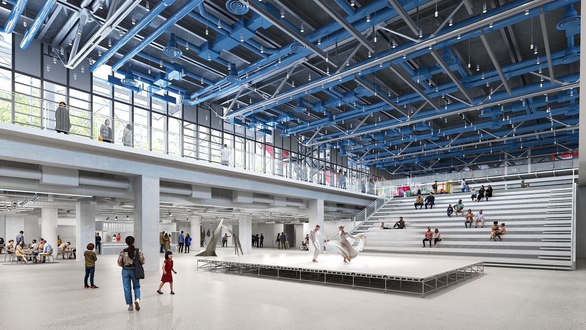 Centre Pompidou facade with the exposed steel and glass escalator tubes above the sloping plaza.