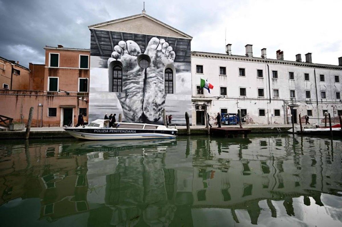 Maurizio Cattelan's mural of bare feet on the exterior facade of the Casa di Reclusione Femminile on Giudecca, the Holy See pavilion at the 60th Venice Biennale.