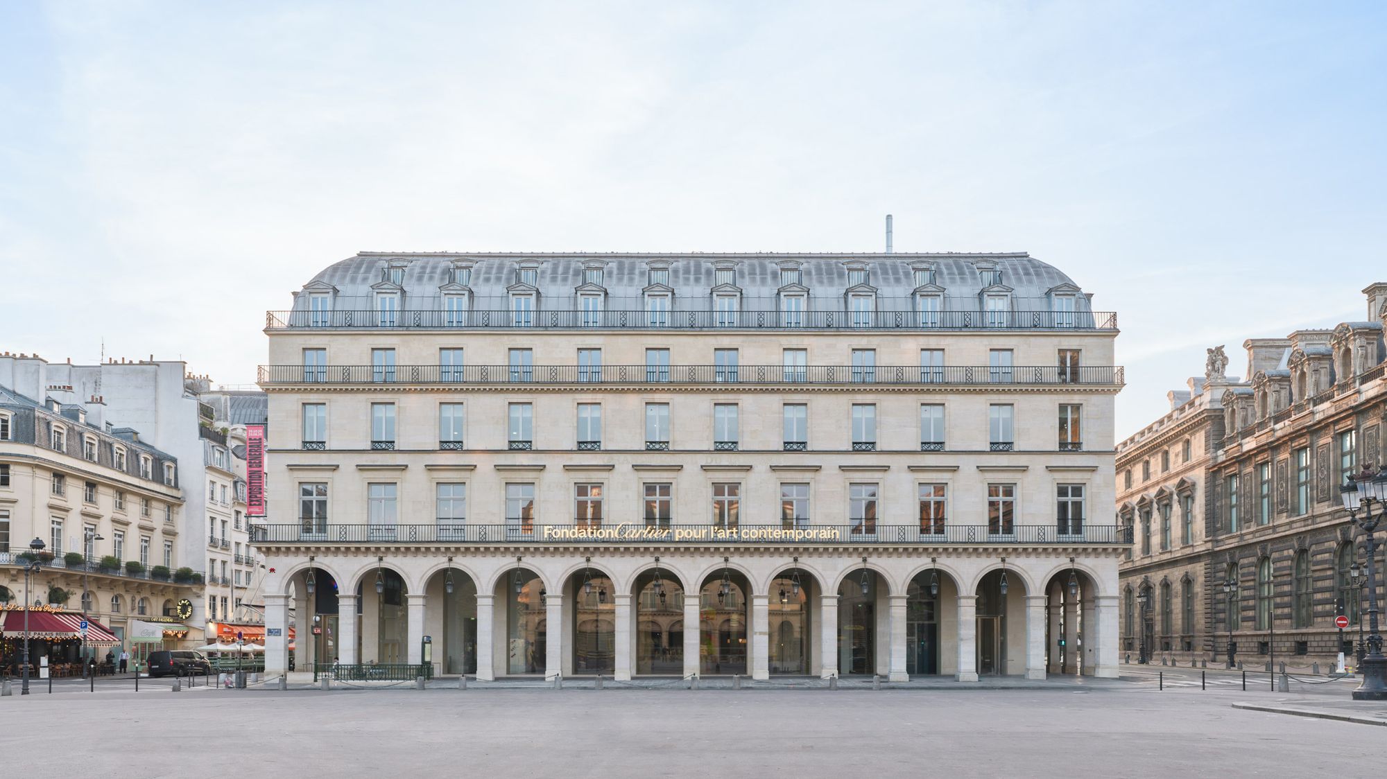 Exterior of the new Fondation Cartier at 2 Place du Palais-Royal, the 1855 Grand Hôtel du Louvre transformed by Jean Nouvel with tall bay windows along the façade.