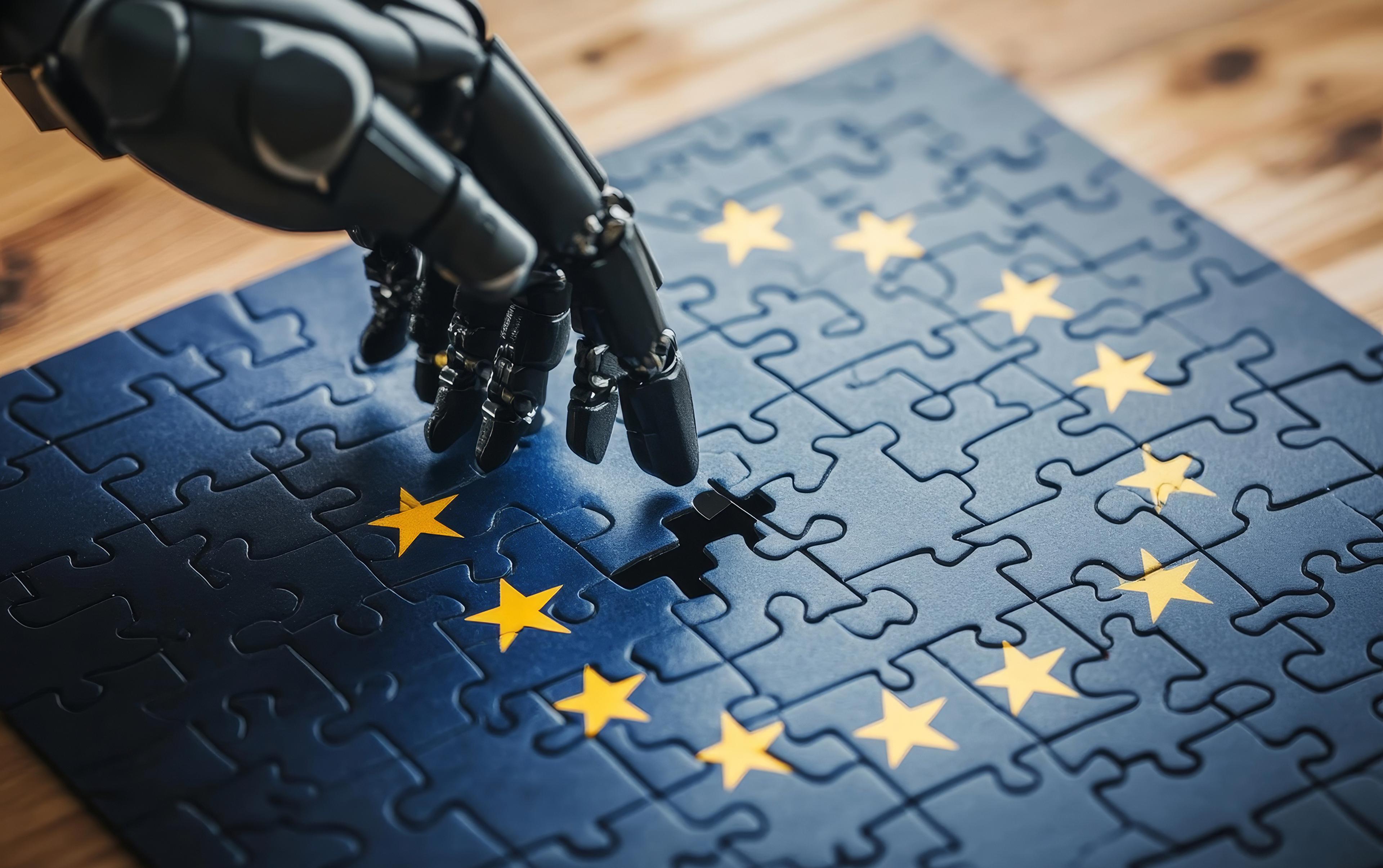 Svart robothånd setter sammen EU-flaggpuslespill på treunderlag