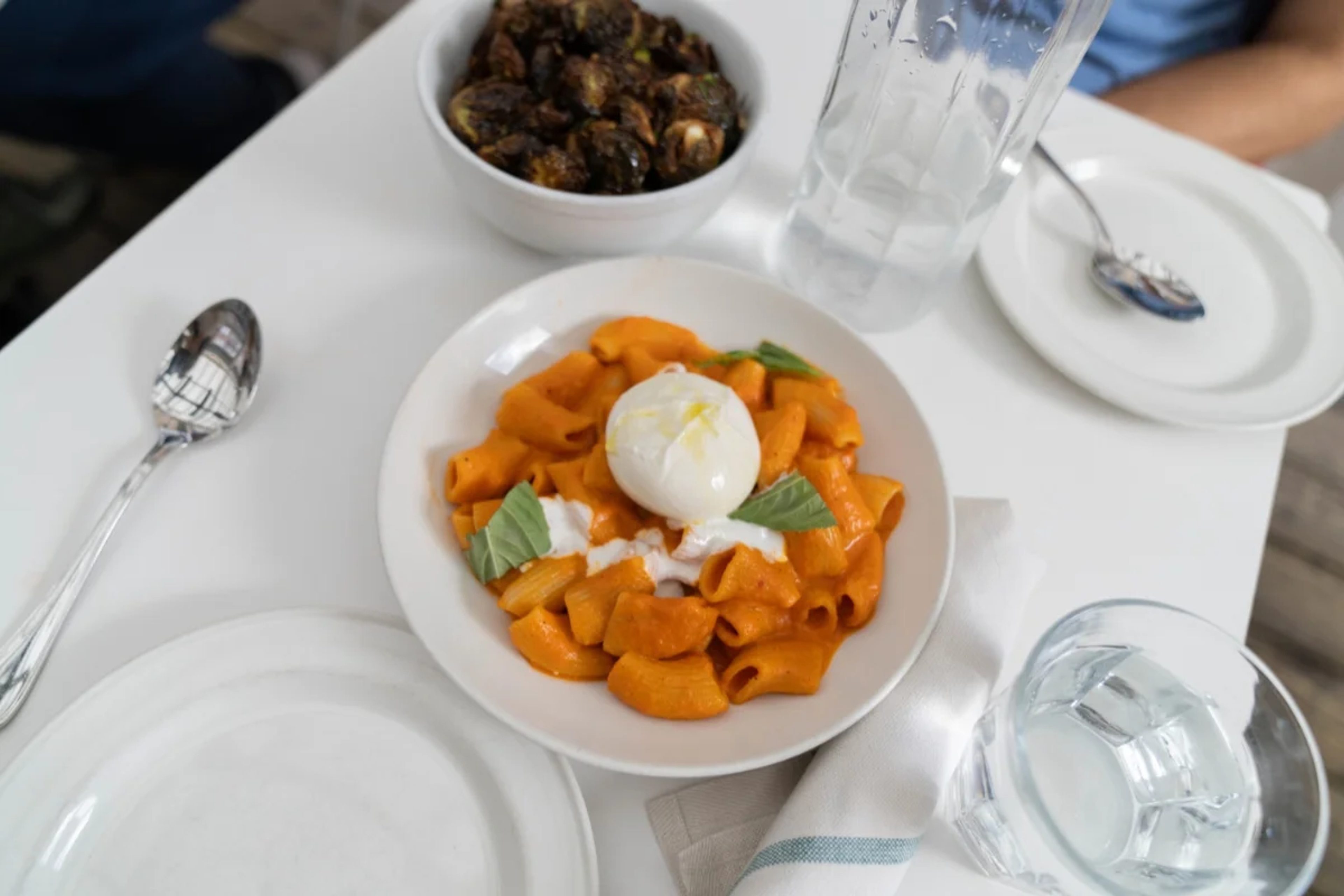 Restaurant table with pasta dish
