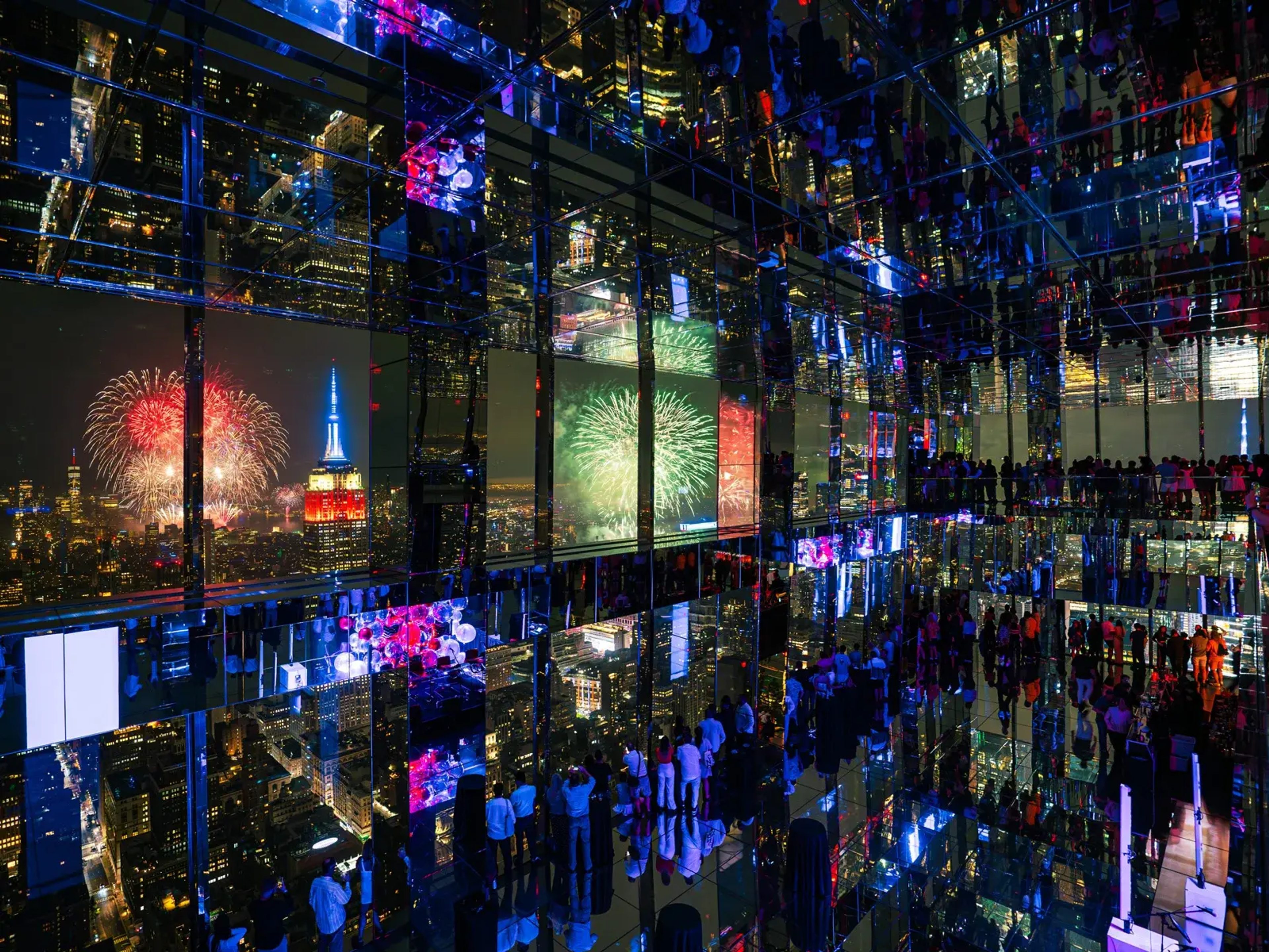Mirrored room at SUMMIT One Vanderbilt with fireworks in the background