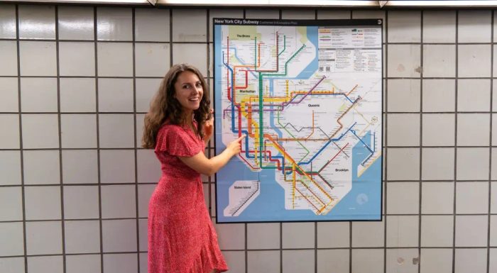 Maureen pointing to a subway map