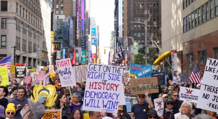 No Kings march in New York with signs