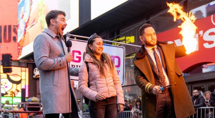 A piece of paper is being burnt in Times Square