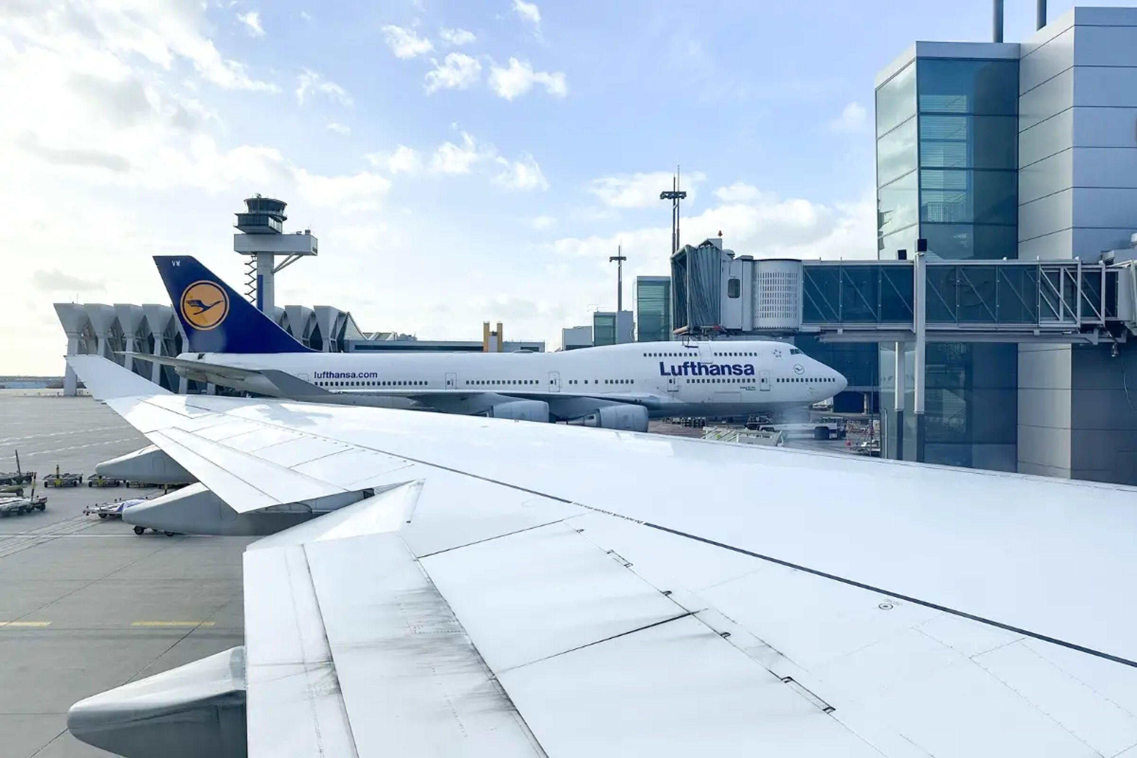 Airport with a Lufthansa 747 aircraft parked
