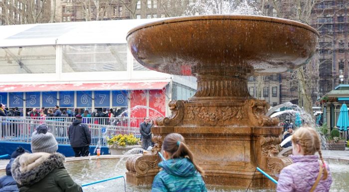 Kids playing fishing the fountain in Bryant Park