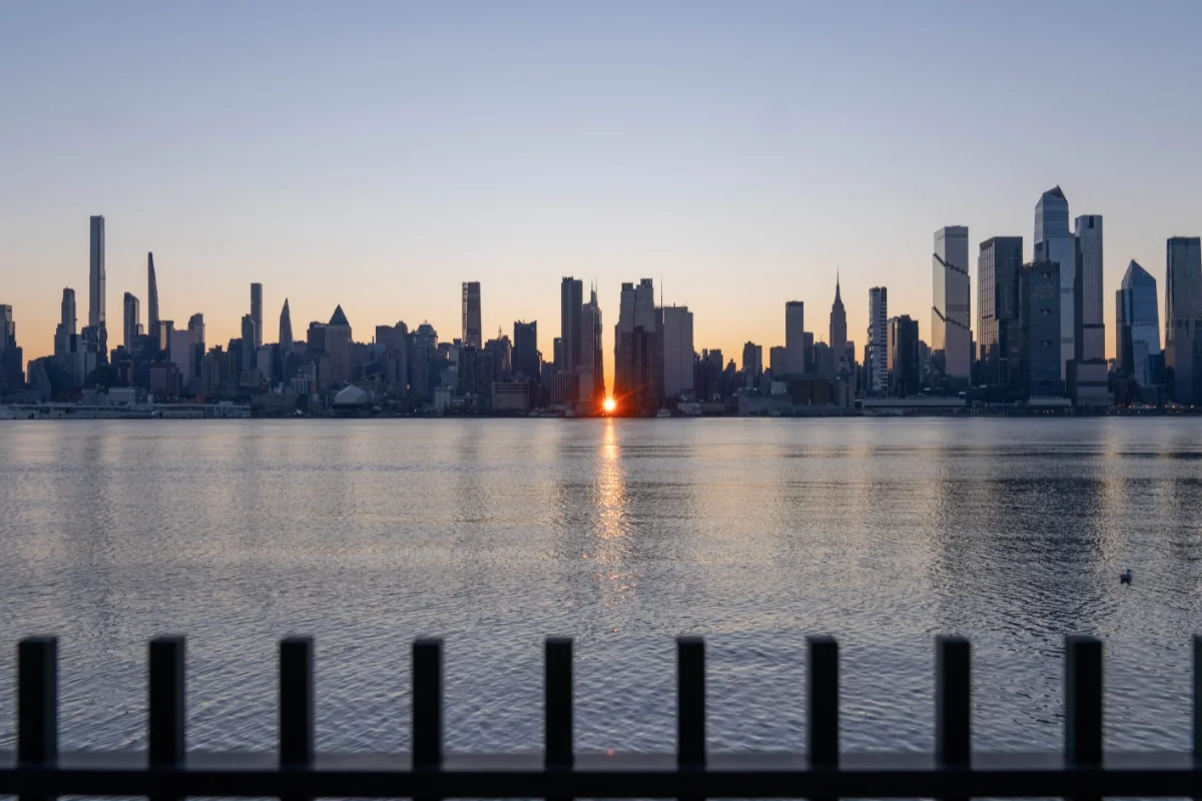New York skyline with Winter Manhattanhenge sunrise