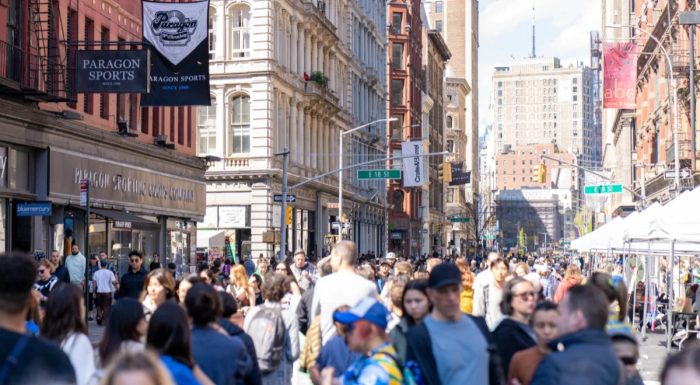 People walking on a car-free Broadway