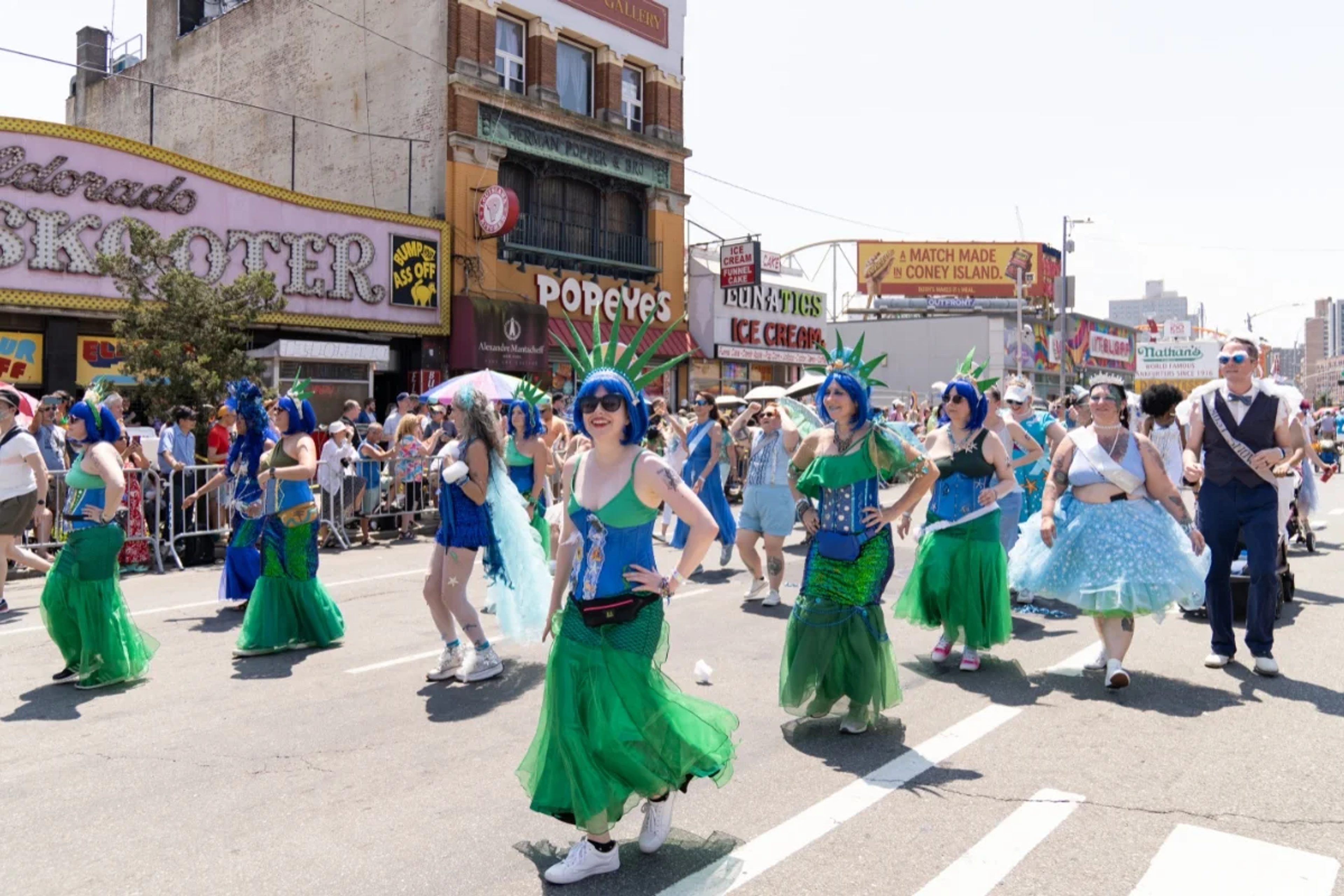 Mermaid Parade participants dressed as the Statue of Liberty on Coney Island