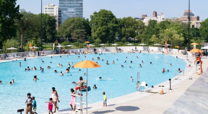 Visitors bathing in the Davis Center Pool in Central Park