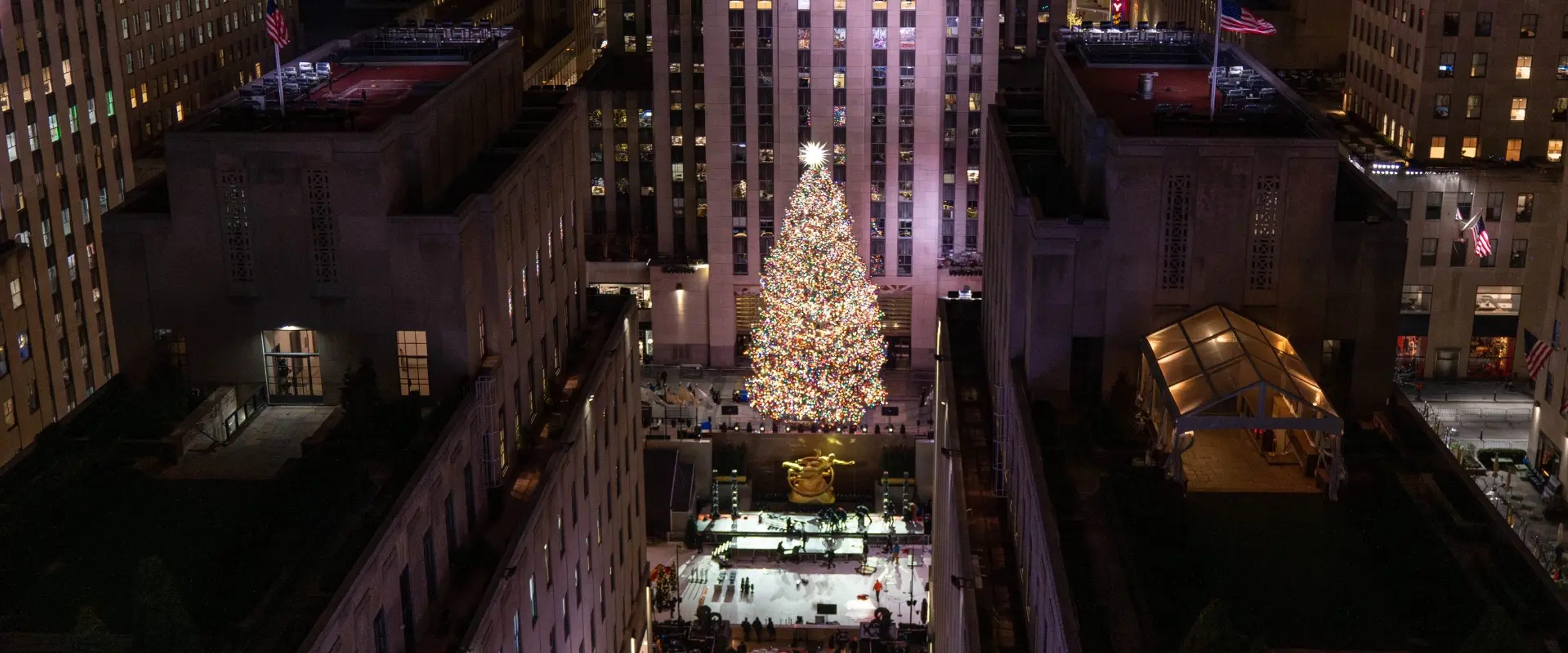 Rockefeller Center Tree lit at night seen from Saks Fifth Avenue rooftop