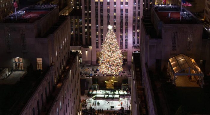 Rockefeller Center Tree lit at night seen from Saks Fifth Avenue rooftop