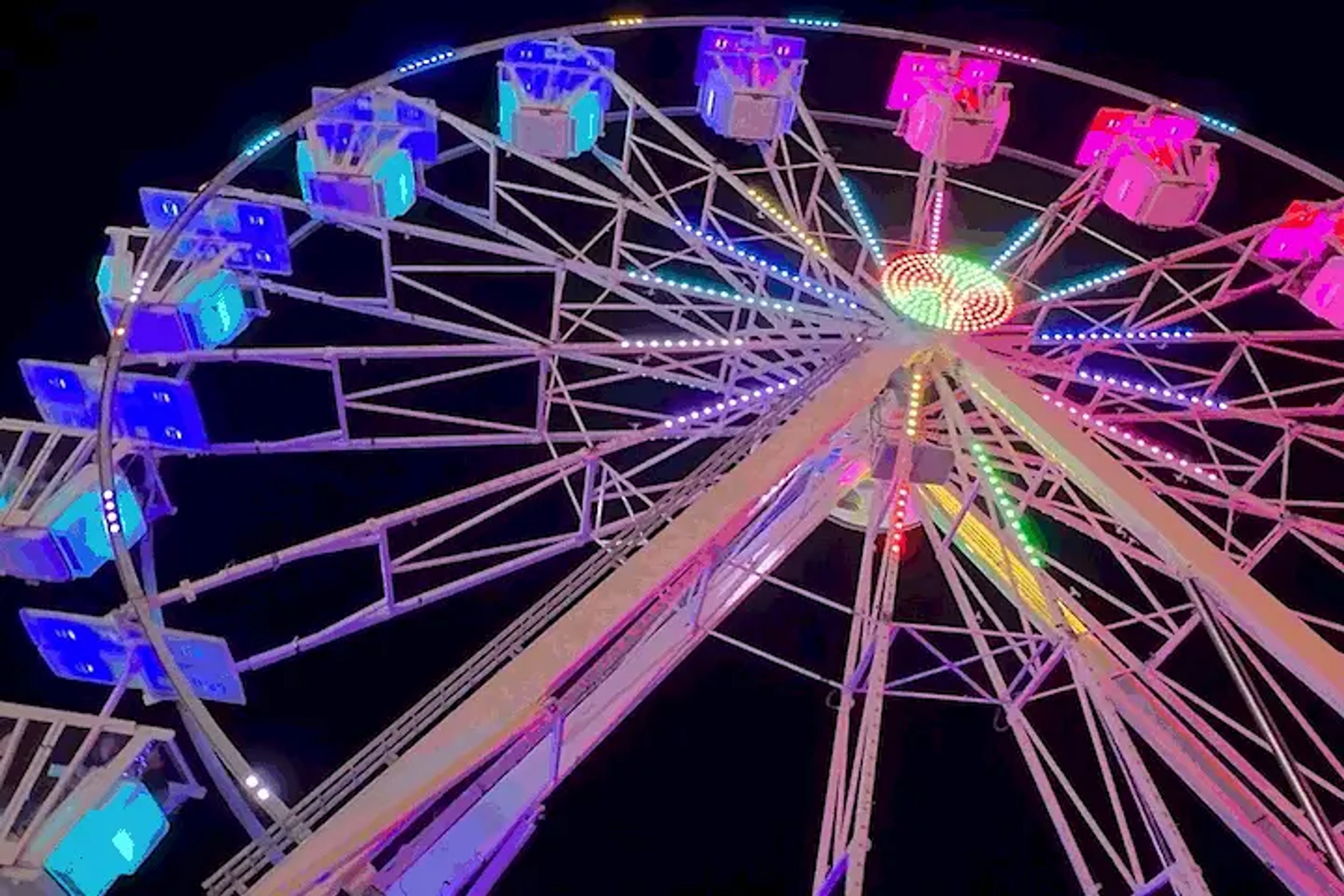 Colorful ferris wheel at night