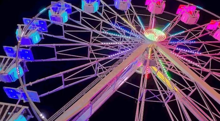Colorful ferris wheel at night