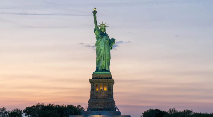 Statue of Liberty during sunset seen from a boat