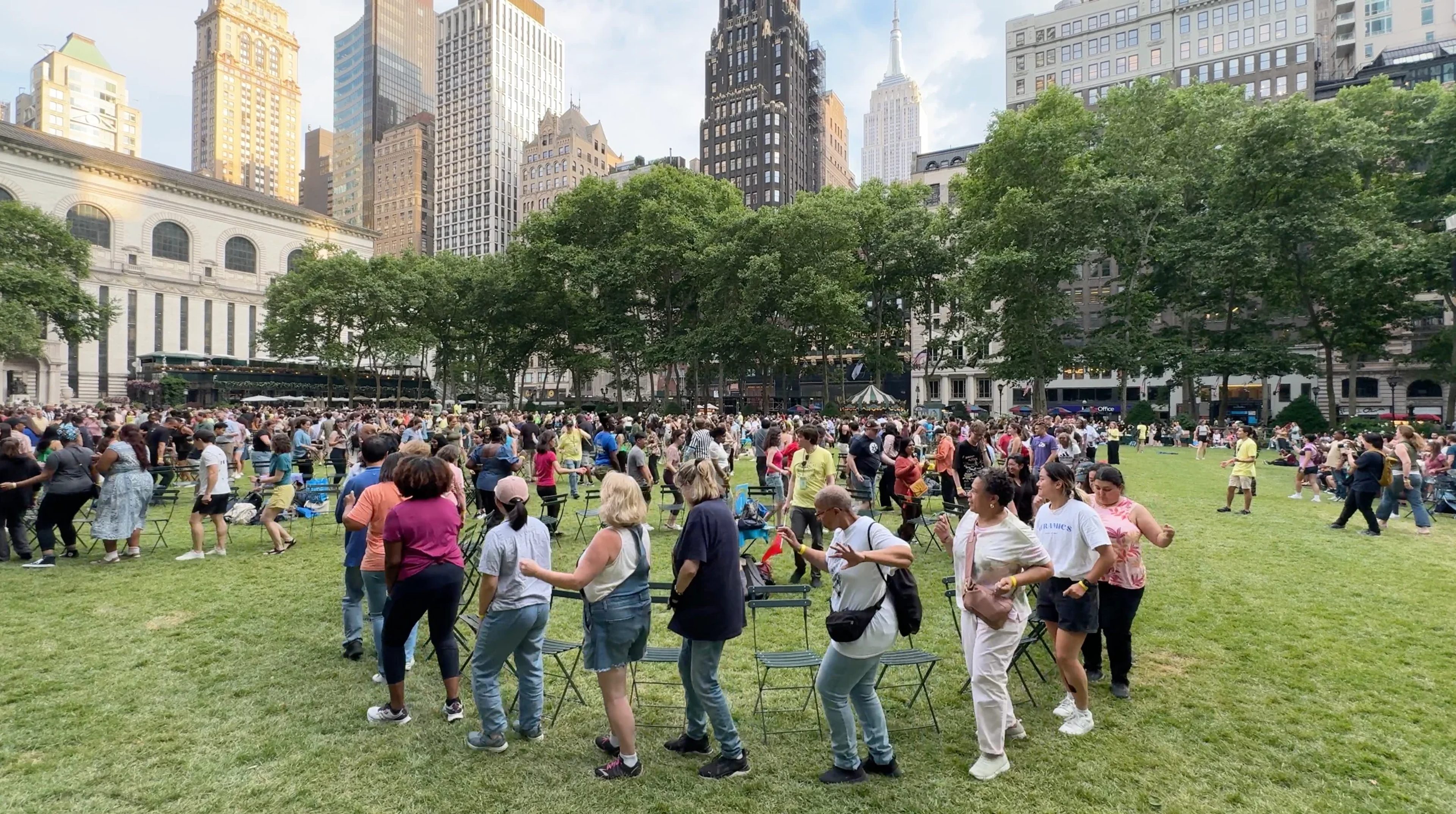 People playing musical chairs in Bryant Park