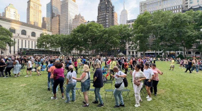 People playing musical chairs in Bryant Park