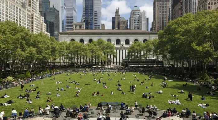 People enjoying the green lawn in Bryant Park